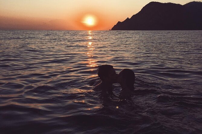 2 Hr Shared Cinque Terre Sunset Cruise with Swim Stop {wine inc!} - The Guvano Beach swim stop: snorkeling gear and a sunset front row seat