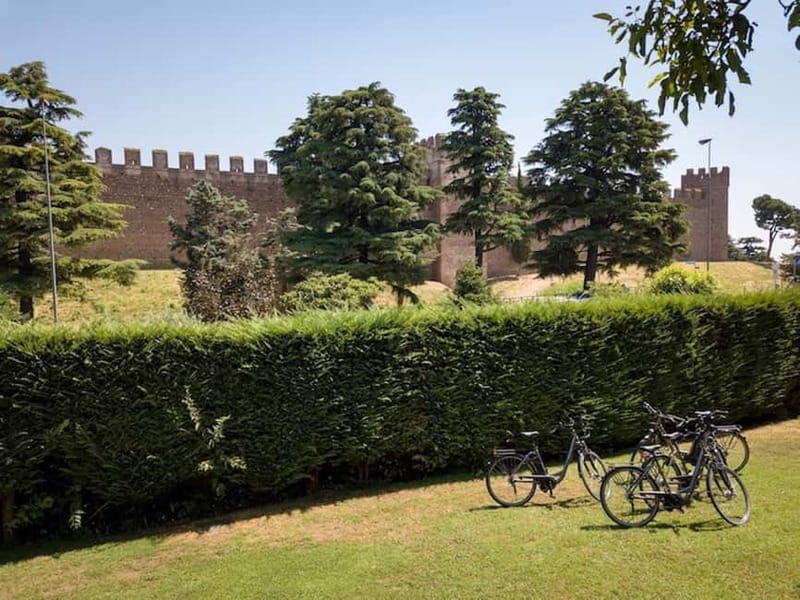 E-bike adventure among villages and medieval castles - The Tione river stretch through orchards and vineyards