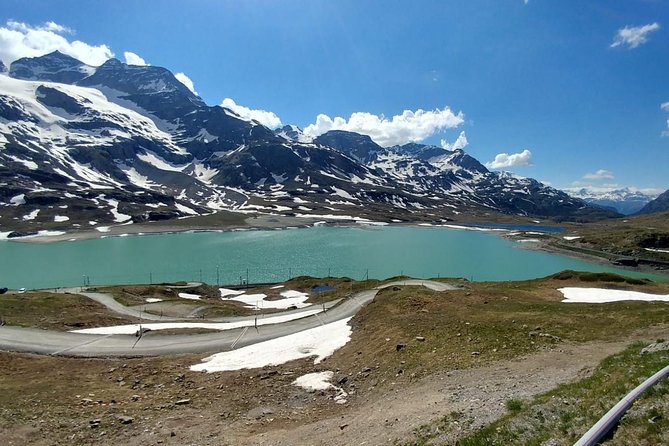 From Lake Como or Milan: Bernina Red Train Tour - Silvaplana and the Maloja Pass drive back through the woods