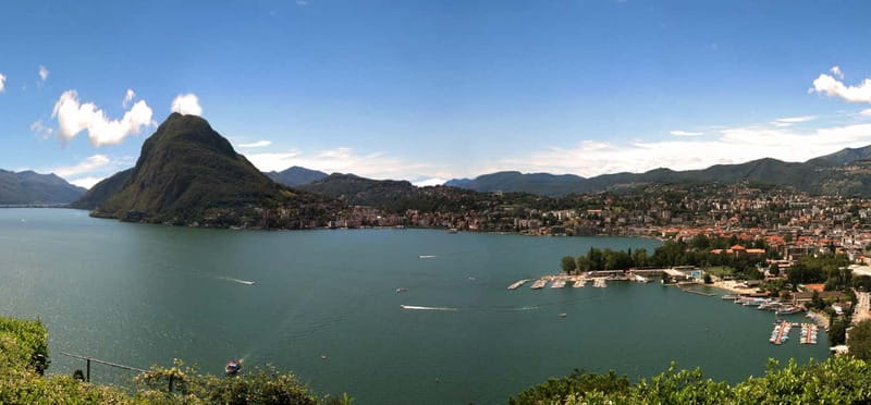 From Milan: Lake Como, Bellagio and Lugano Private Boat Tour - The big viewpoint payoff: alpine peaks behind sparkling blue water