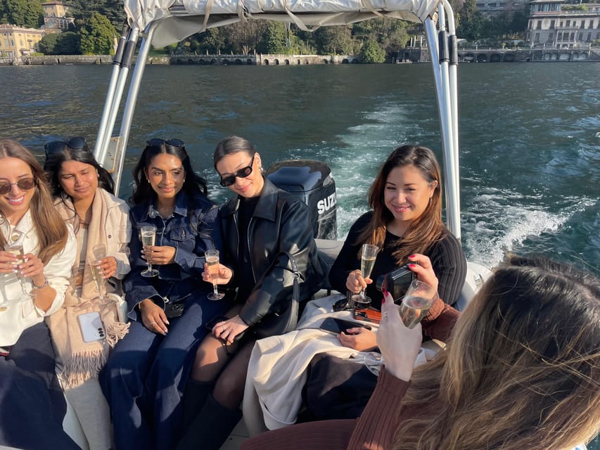Lake Como: Shared Boat Tour with Prosecco Aperitif - The boat setup: cushioned seating, canopy, and real photo angles
