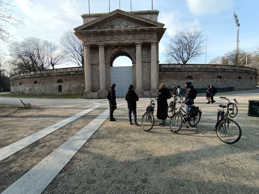 Milan: Guided Bike Tour - Piazza Affari to L.O.V.E by Maurizio Cattelan, modern art with real street context